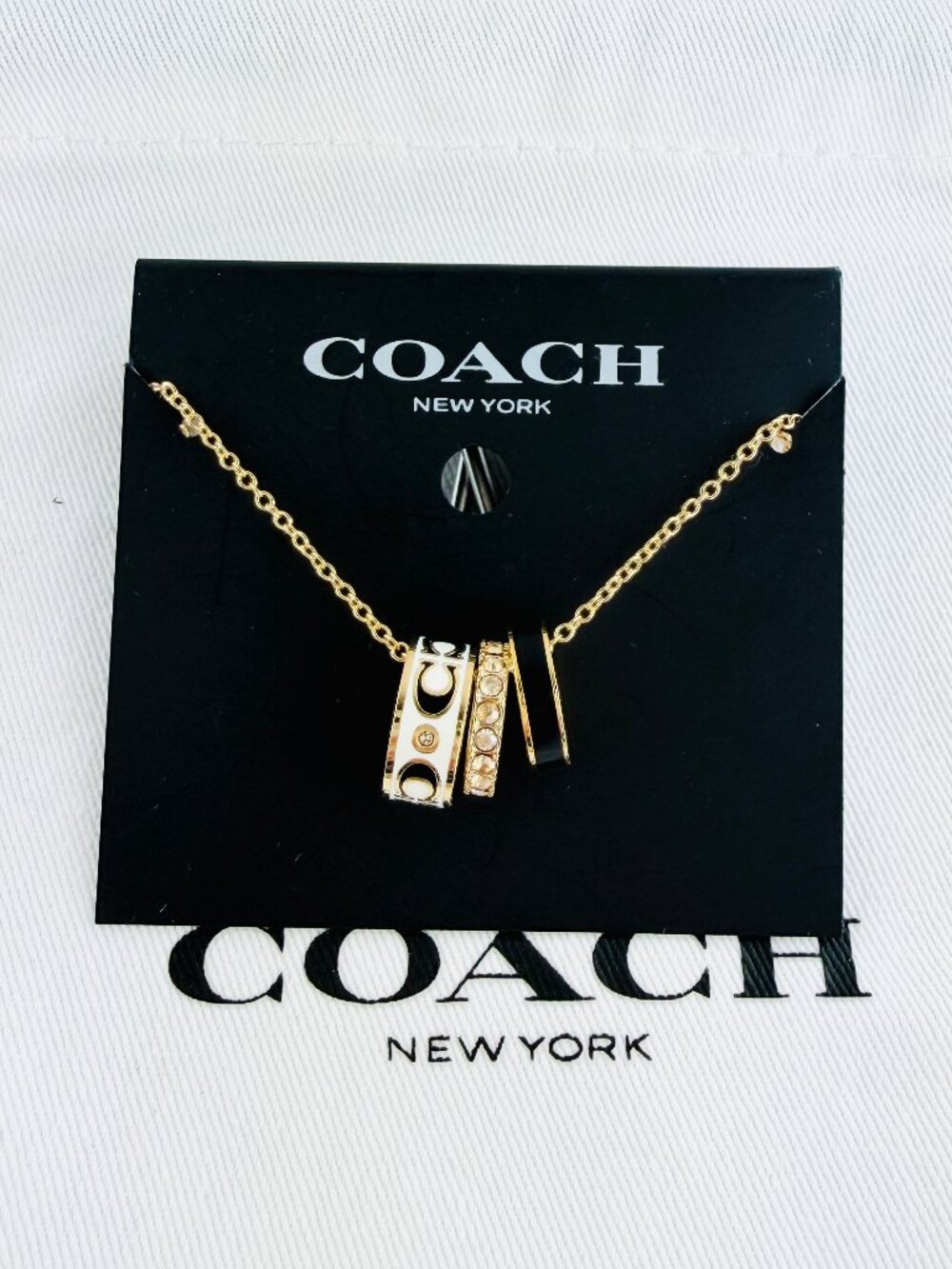 New Coach Signature Enamel Black White gold necklace